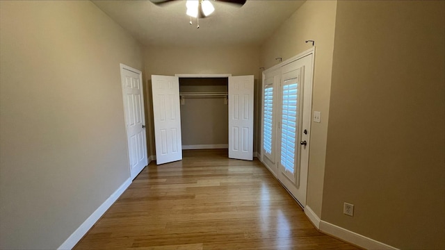 1718 Elgin St, Houston, TX 77004 - unfurnished bedroom with light wood-type flooring, baseboards, and a ceiling fan