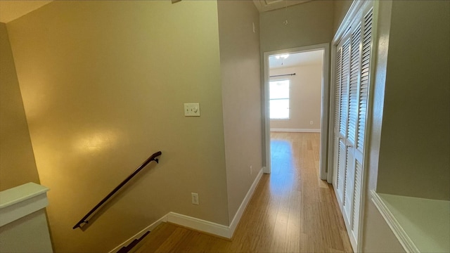 1718 Elgin St, Houston, TX 77004 - hallway featuring an upstairs landing, attic access, light wood-type flooring, and baseboards