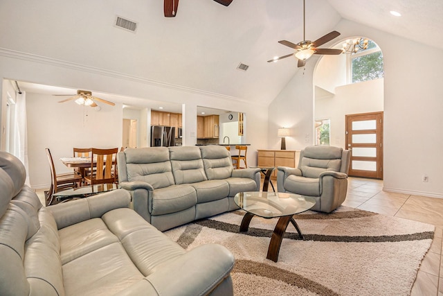 living room with light tile patterned floors, high vaulted ceiling, a ceiling fan, and visible vents