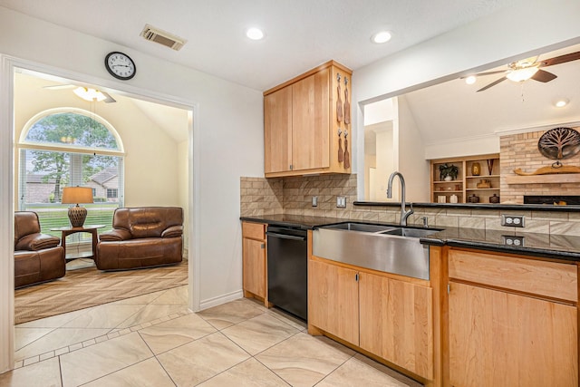kitchen featuring visible vents, vaulted ceiling, dishwasher, a sink, and open floor plan