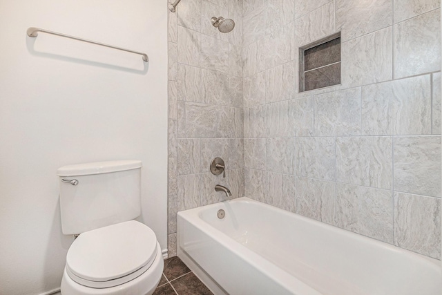 full bath with tile patterned floors, toilet, and shower / tub combination
