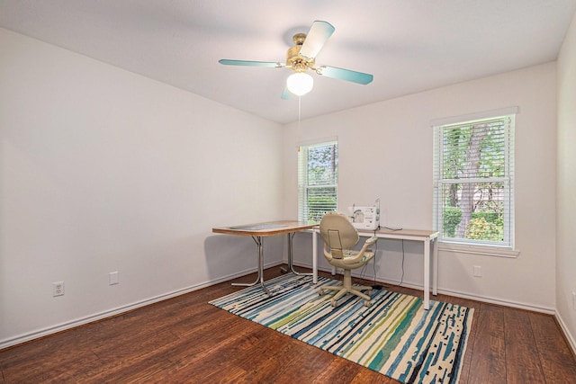 office area with baseboards, a ceiling fan, and wood finished floors