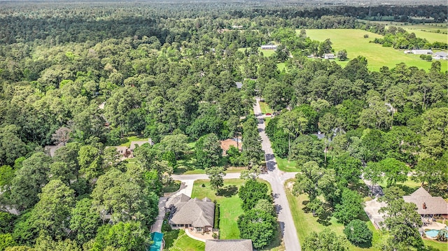 birds eye view of property with a wooded view