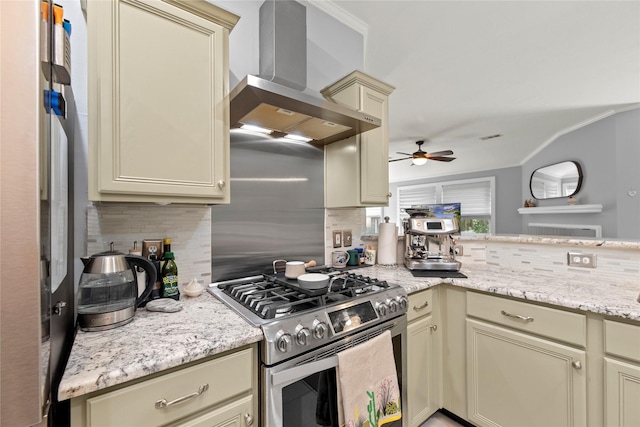 20415 Aspenwilde Dr, Cypress, TX 77433 - kitchen with cream cabinets, wall chimney range hood, ceiling fan, stainless steel appliances, and decorative backsplash