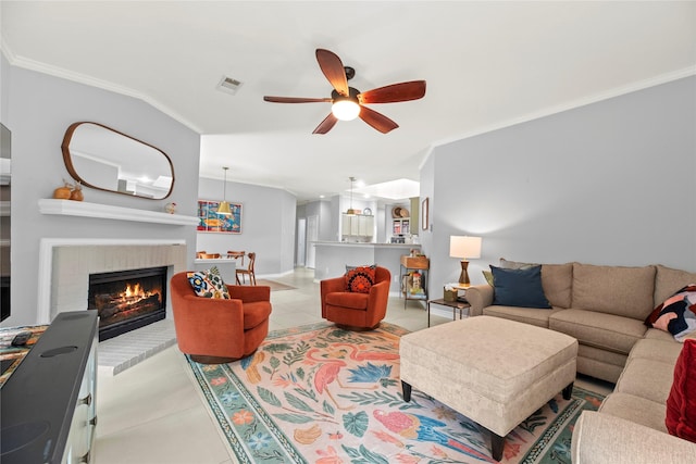 20415 Aspenwilde Dr, Cypress, TX 77433 - living room featuring ceiling fan, visible vents, a fireplace, light tile patterned floors, and ornamental molding