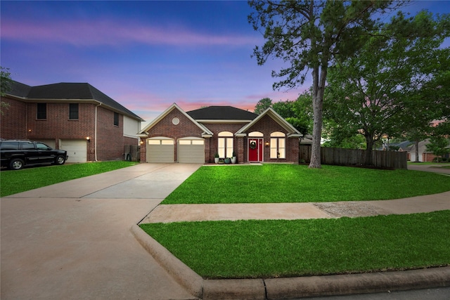 20415 Aspenwilde Dr, Cypress, TX 77433 - view of front of home with concrete driveway, brick siding, an attached garage, and a front lawn