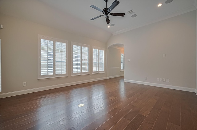 unfurnished room with visible vents, arched walkways, ceiling fan, and a healthy amount of sunlight