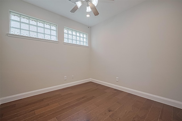 empty room with baseboards, recessed lighting, dark wood finished floors, and ceiling fan