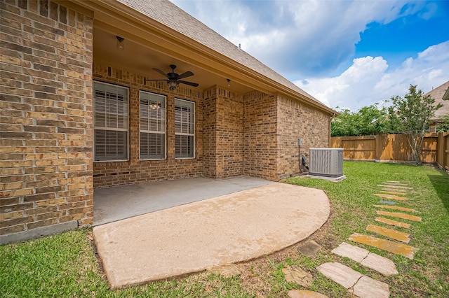 view of patio / terrace featuring central AC, fence, and a ceiling fan