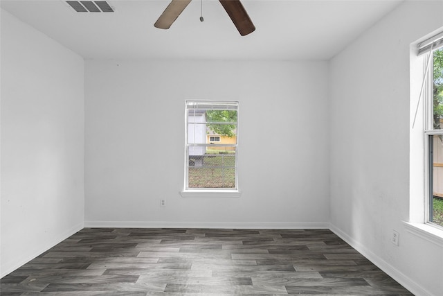 6090 Skylane Dr, Montgomery, TX 77316 - empty room featuring visible vents, ceiling fan, wood finished floors, and a healthy amount of sunlight