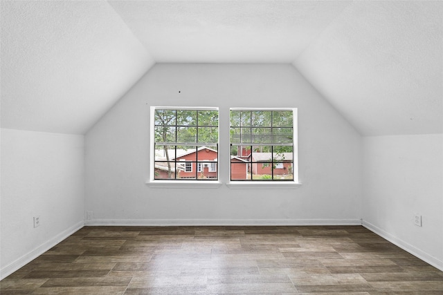 6090 Skylane Dr, Montgomery, TX 77316 - bonus room with a textured ceiling, wood finished floors, and vaulted ceiling