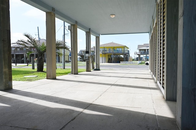 surrounding community featuring a yard, a residential view, and a carport