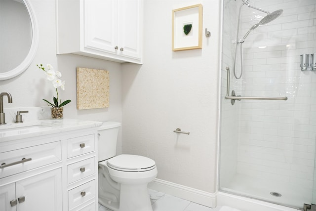 full bathroom with toilet, baseboards, a shower stall, and vanity