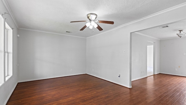empty room with visible vents, a textured ceiling, ceiling fan, and wood finished floors