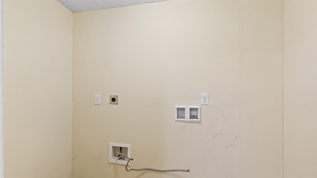 clothes washing area with washer hookup, hookup for an electric dryer, and laundry area