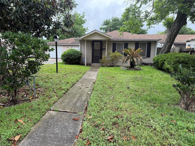 4300 Weaver Rd, Houston, TX 77016 - ranch-style home with a front lawn