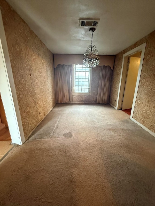 4300 Weaver Rd, Houston, TX 77016 - unfurnished dining area featuring a notable chandelier, wallpapered walls, visible vents, and light carpet