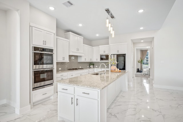 453 Stratus View Ct, Katy, TX 77493 - kitchen featuring stainless steel appliances, baseboards, a sink, and marble finish floor