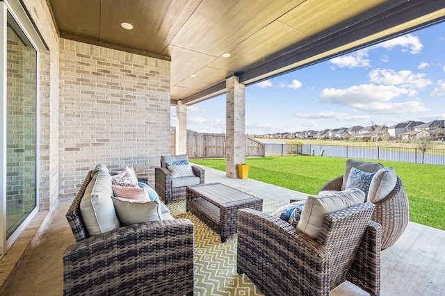 453 Stratus View Ct, Katy, TX 77493 - view of patio / terrace featuring a water view, a fenced backyard, outdoor lounge area, and a residential view