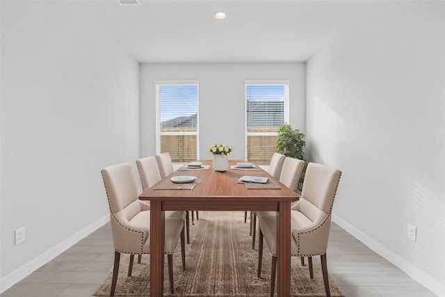 dining space featuring recessed lighting and baseboards