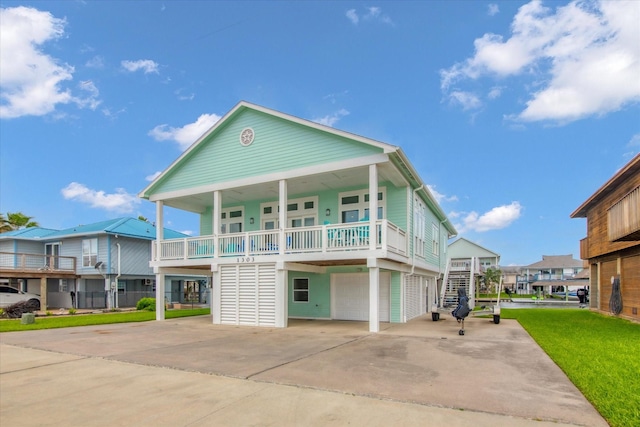 1303 Blue Heron St, Bayou Vista, TX 77563 - coastal home featuring an attached garage, covered porch, stairway, a carport, and driveway