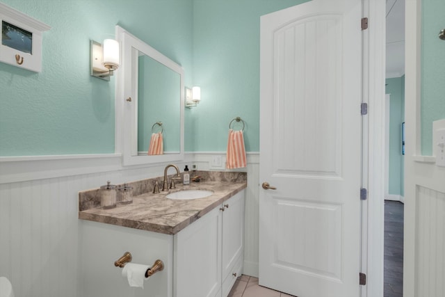 1303 Blue Heron St, Bayou Vista, TX 77563 - bathroom with a wainscoted wall and vanity