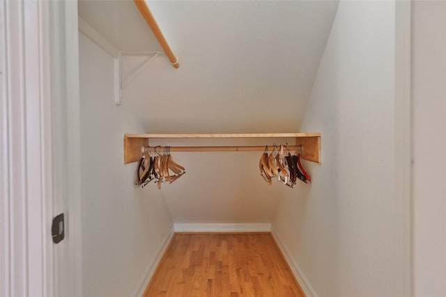 spacious closet featuring light wood-style flooring