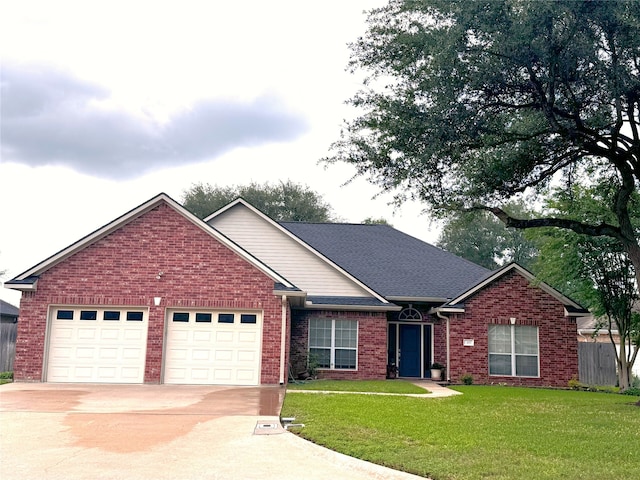 ranch-style house with brick siding, an attached garage, driveway, and a front lawn