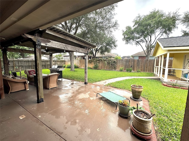 view of patio / terrace with a fenced backyard and a grill