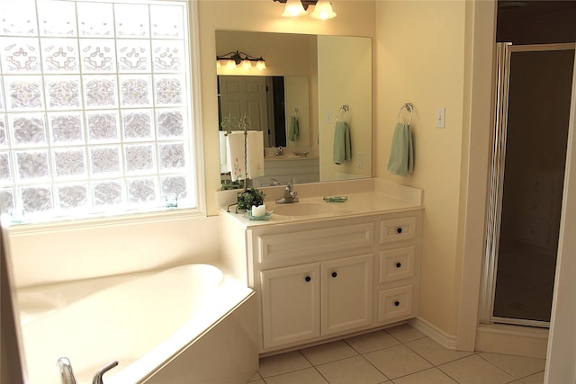 full bath with tile patterned floors, a shower stall, vanity, and a bath