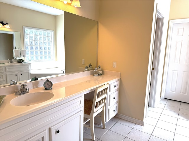 bathroom featuring baseboards, tile patterned flooring, and vanity