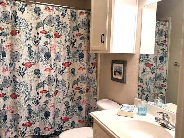 bathroom with vanity, toilet, and a shower with shower curtain