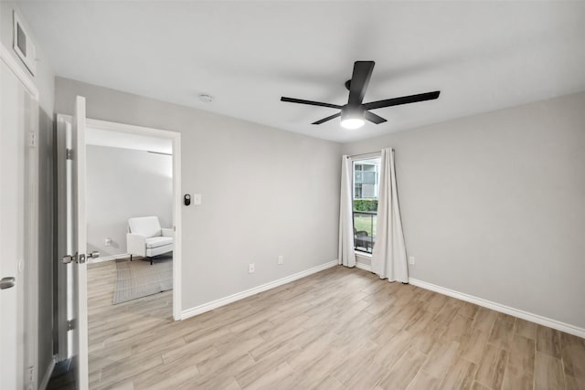 unfurnished bedroom featuring baseboards, a ceiling fan, light wood-type flooring, and visible vents