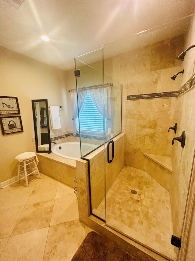 2731 Sea Ledge Dr, Seabrook, TX 77586 - bathroom featuring a stall shower, a bath, and tile patterned flooring