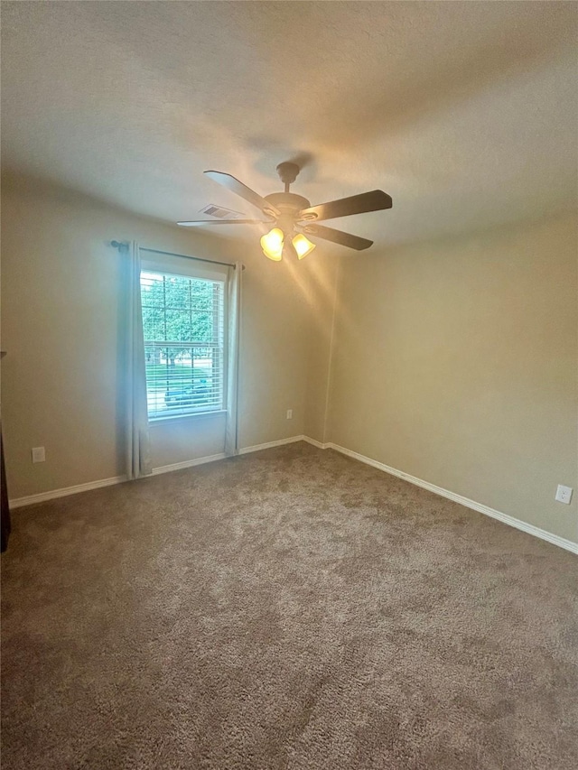 2731 Sea Ledge Dr, Seabrook, TX 77586 - unfurnished room featuring carpet, ceiling fan, baseboards, and a textured ceiling