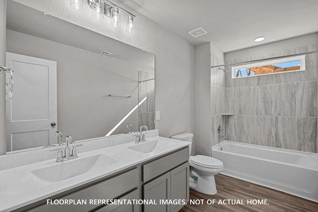 full bathroom featuring a sink, toilet, and visible vents