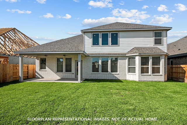 back of house with a patio, a fenced backyard, roof with shingles, a ceiling fan, and a lawn