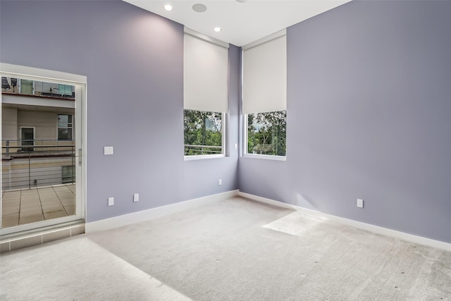 102 Quitman St Unit 301, Houston, TX 77009 - spare room featuring carpet flooring, baseboards, and recessed lighting