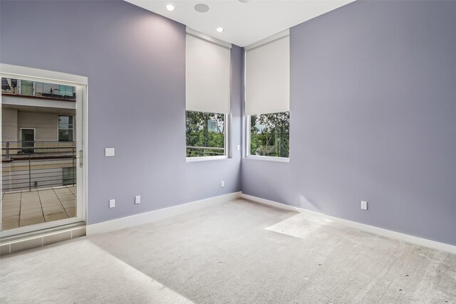 102 Quitman St Unit 301, Houston, TX 77009 - spare room featuring carpet flooring, baseboards, and recessed lighting
