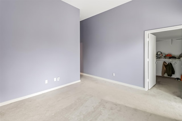 102 Quitman St Unit 301, Houston, TX 77009 - unfurnished bedroom with carpet flooring, a closet, baseboards, and a walk in closet
