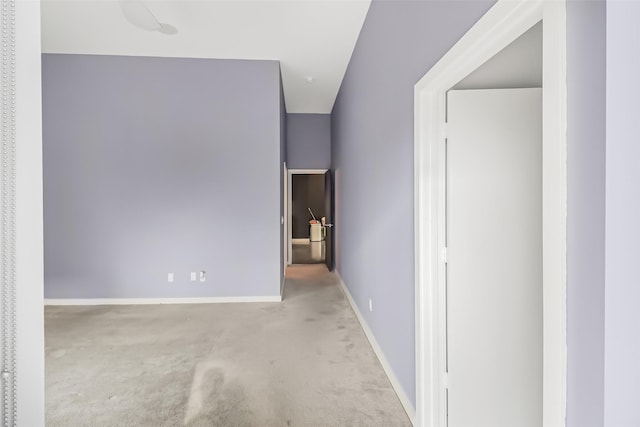 interior space featuring baseboards and carpet flooring