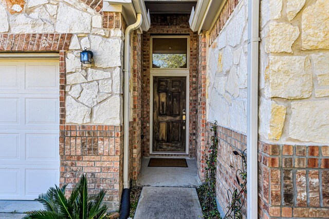 11022 Jacob Crossing Dr, Richmond, TX 77406 - view of exterior entry with brick siding and stone siding
