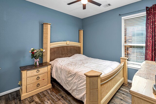 11022 Jacob Crossing Dr, Richmond, TX 77406 - bedroom with dark wood-style flooring, baseboards, and visible vents