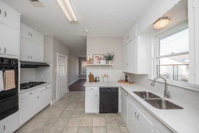 kitchen with visible vents, open shelves, a sink, light tile patterned floors, and black appliances