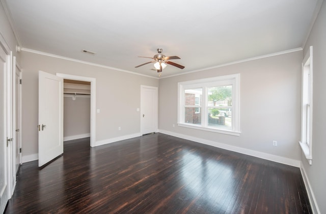 unfurnished bedroom with ceiling fan, visible vents, baseboards, dark wood-style floors, and ornamental molding