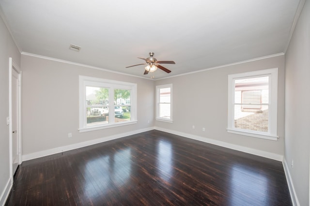 unfurnished room featuring crown molding, dark wood-style flooring, a ceiling fan, baseboards, and visible vents