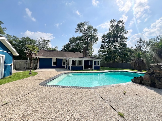 view of pool featuring a patio, a fenced in pool, and a fenced backyard
