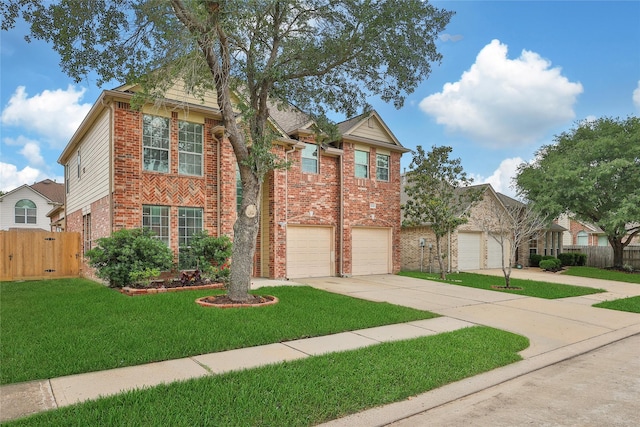 view of front of property with fence, an attached garage, brick siding, a front yard, and driveway