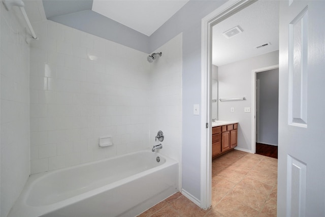 bathroom with  shower combination, visible vents, tile patterned flooring, and vanity