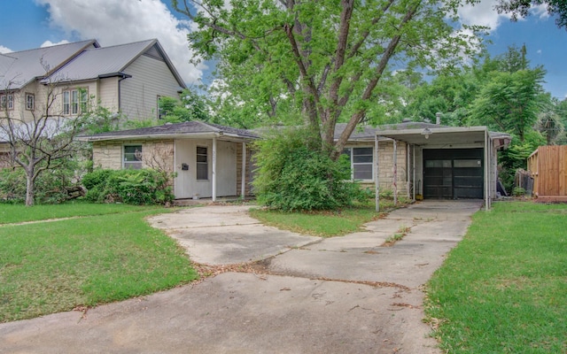 view of front of home featuring stone siding, concrete driveway, and a front yard